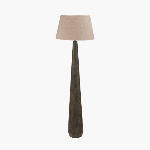 Tall floor lamp with a textured base and beige lampshade on a white background
